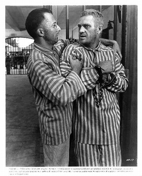 Dustin Hoffman (as Dega) welcomes McQueen (as Papillon) 
after his release from solitary confinement.